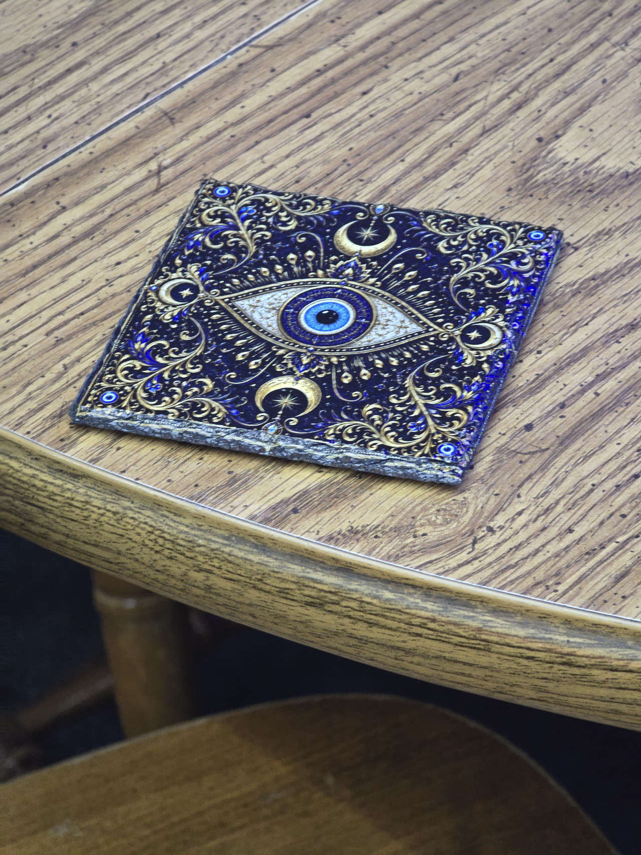 Full-color eye artwork UV printed onto natural slate